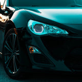 RGB Chasing Color Adjustable Frozen Angry Eye Shroud LED Projector H4 Headlight Retrofit Kits for Landcruiser